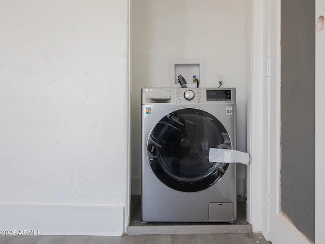 laundry area with laundry area and washer / clothes dryer