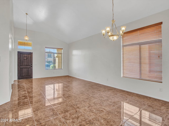 interior space with lofted ceiling and a notable chandelier