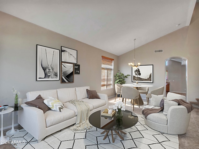 living room with vaulted ceiling and an inviting chandelier