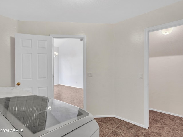 interior space with tile patterned floors and washer and clothes dryer