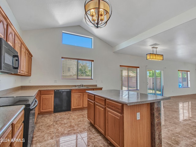 kitchen with a wealth of natural light, black appliances, decorative light fixtures, and a kitchen island