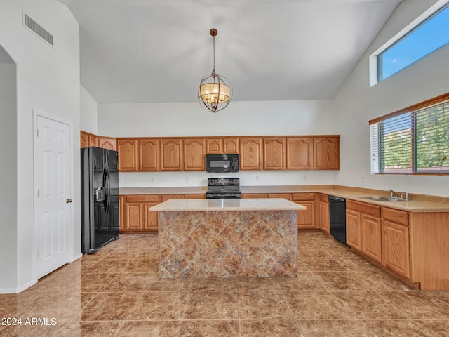 kitchen with sink, black appliances, a center island, pendant lighting, and high vaulted ceiling