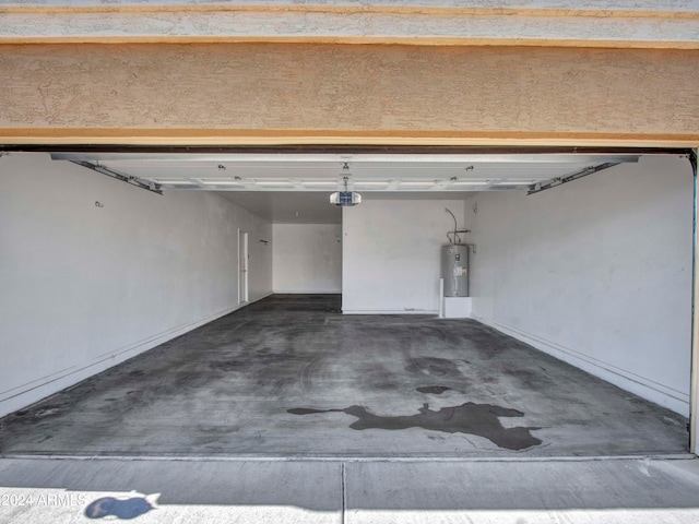 garage featuring a garage door opener and water heater