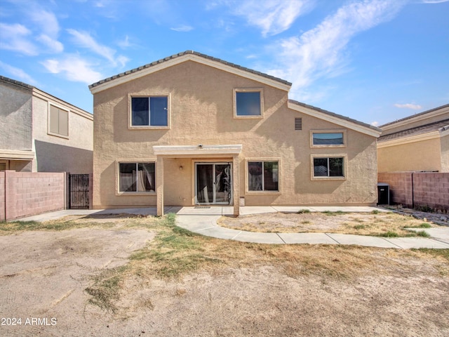 rear view of property featuring a patio area