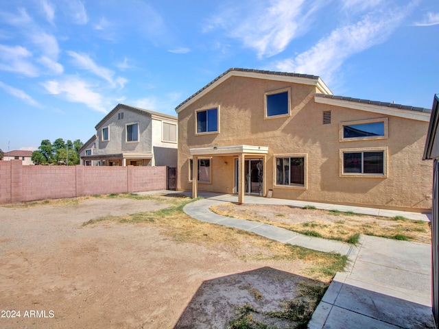 rear view of house featuring a patio