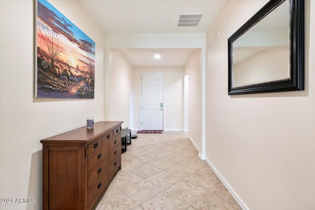 corridor featuring light tile patterned flooring