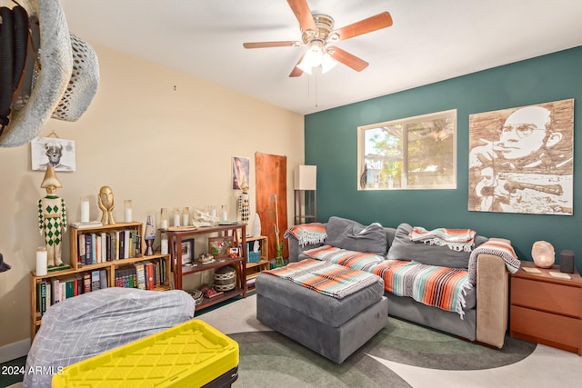 living room featuring carpet and ceiling fan