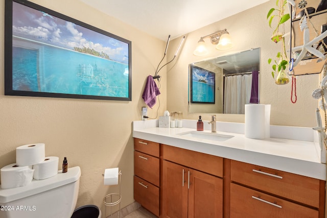 bathroom featuring vanity, toilet, and walk in shower