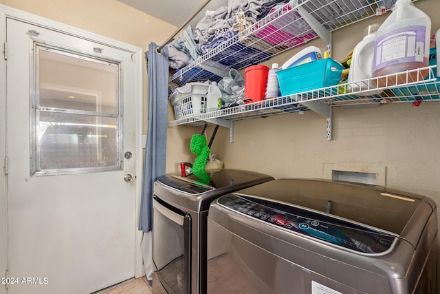 laundry room with washing machine and dryer