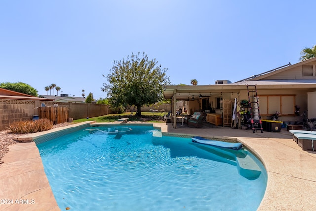 view of pool with a patio area and a diving board