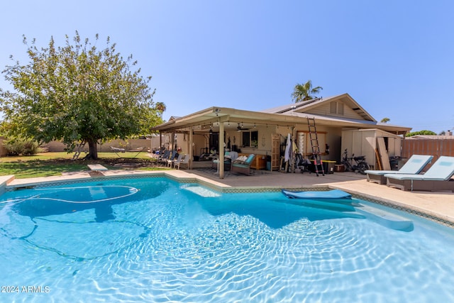 view of pool featuring a patio and ceiling fan