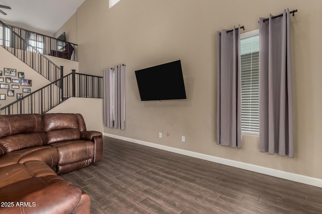 887 W Santa Gertrudis Trl, San Tan Valley, AZ 85143 - living room with baseboards, dark wood-type flooring, and stairway