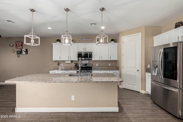 887 W Santa Gertrudis Trl, San Tan Valley, AZ 85143 - kitchen featuring stainless steel appliances, dark wood-style flooring, a center island with sink, baseboards, and a sink