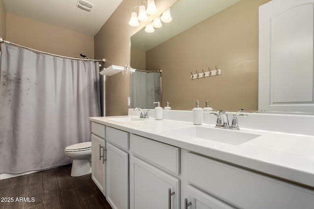 887 W Santa Gertrudis Trl, San Tan Valley, AZ 85143 - full bath with toilet, wood finished floors, and double vanity
