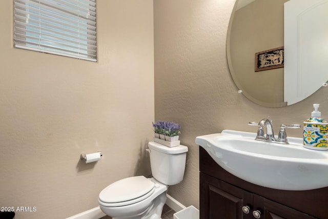 887 W Santa Gertrudis Trl, San Tan Valley, AZ 85143 - half bathroom featuring baseboards, vanity, toilet, and a textured wall