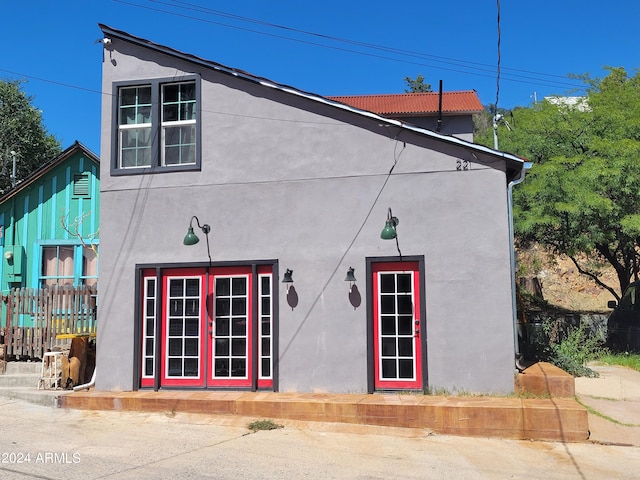 view of side of home featuring french doors