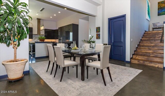 dining space with a high ceiling