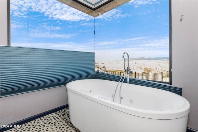 bathroom with tile floors and a wealth of natural light