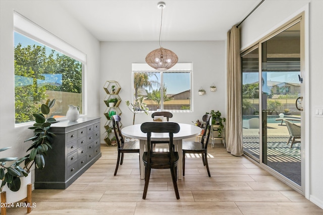 21487 E Arroyo Verde Dr, Queen Creek, AZ 85142 - dining space featuring light wood-style flooring