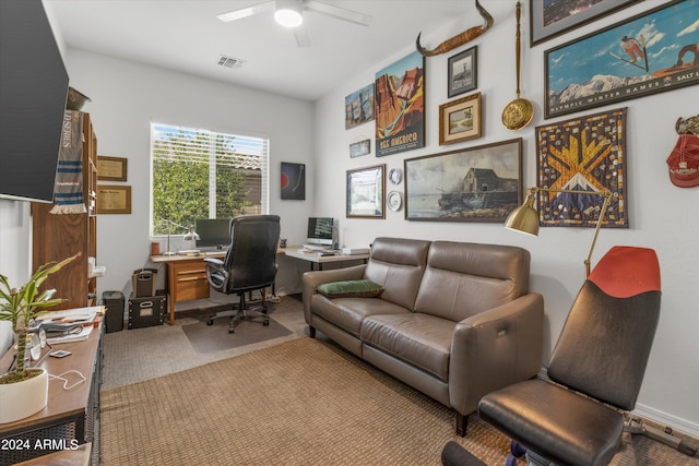 office area with ceiling fan and carpet flooring