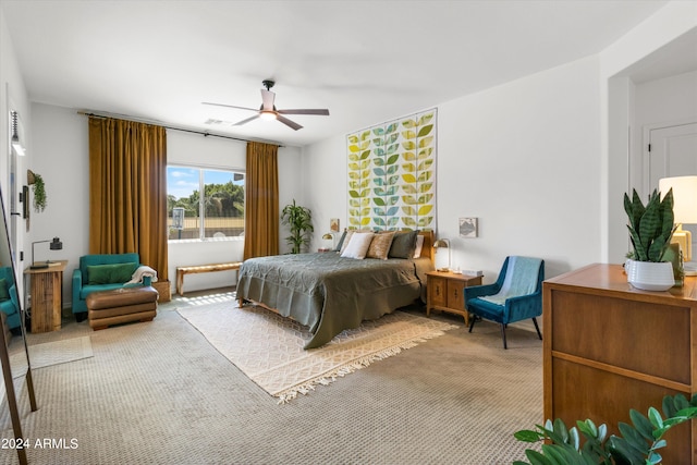 bedroom featuring ceiling fan and carpet