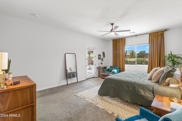 21487 E Arroyo Verde Dr, Queen Creek, AZ 85142 - carpeted bedroom with access to outside, visible vents, baseboards, and a ceiling fan