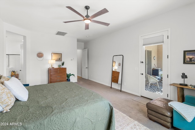 carpeted bedroom with ceiling fan and access to outside