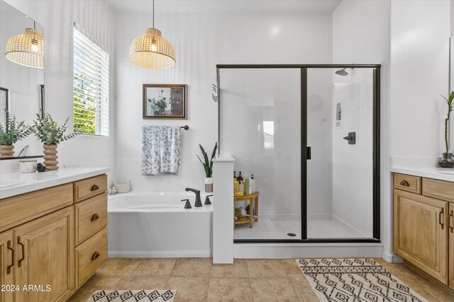 bathroom featuring vanity, plus walk in shower, and tile patterned floors