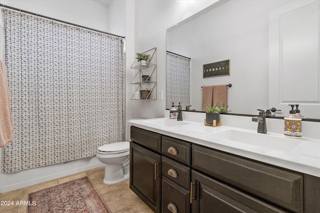 bathroom with walk in shower, tile patterned floors, vanity, and toilet