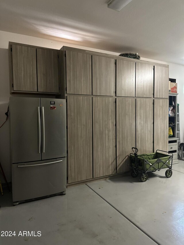 garage featuring stainless steel fridge