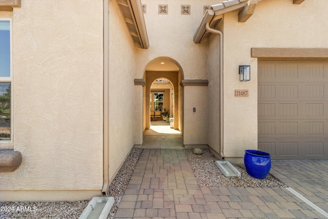 21487 E Arroyo Verde Dr, Queen Creek, AZ 85142 - property entrance featuring a garage and stucco siding