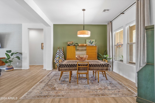 dining area featuring wood-type flooring