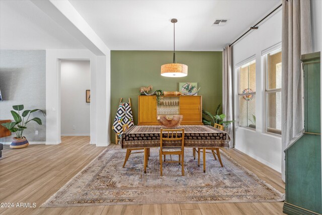 21487 E Arroyo Verde Dr, Queen Creek, AZ 85142 - dining area featuring visible vents, baseboards, and wood finished floors