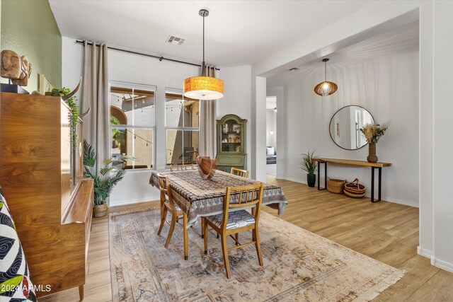 dining area featuring light wood-type flooring