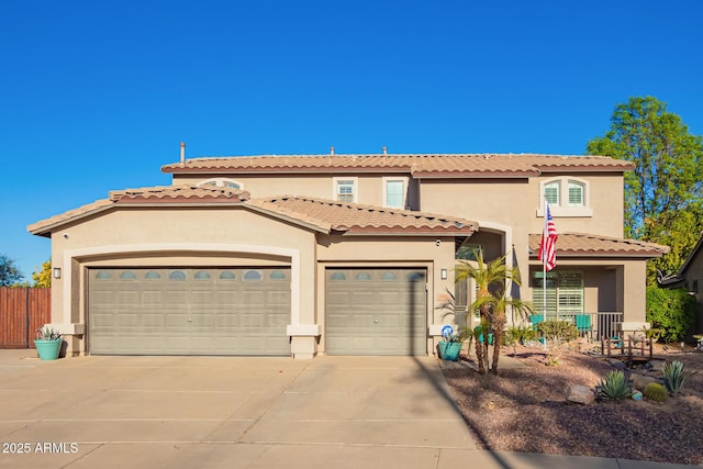 mediterranean / spanish-style home with a garage