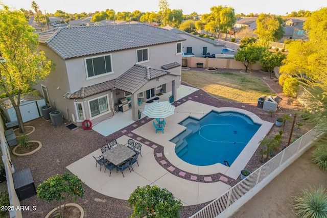 view of pool with central air condition unit and a patio