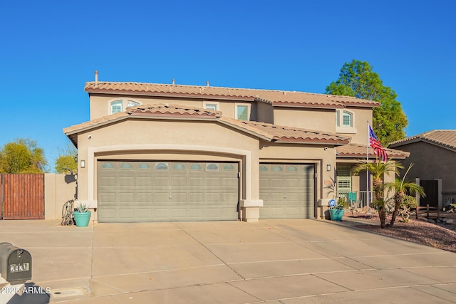 mediterranean / spanish home featuring a garage