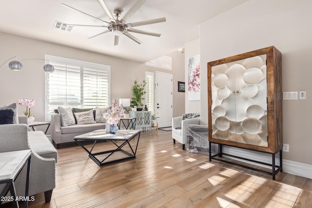 living room with hardwood / wood-style floors and ceiling fan