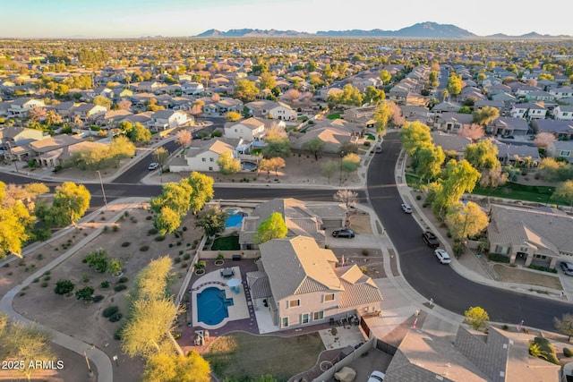 birds eye view of property with a mountain view