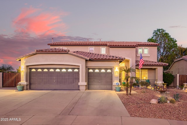 mediterranean / spanish house featuring a garage