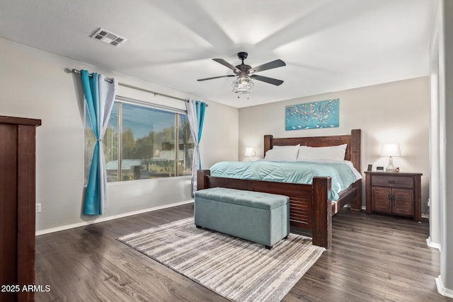 bedroom featuring ceiling fan and dark wood-type flooring