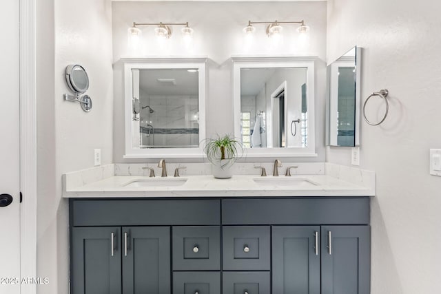 bathroom with vanity and tiled shower