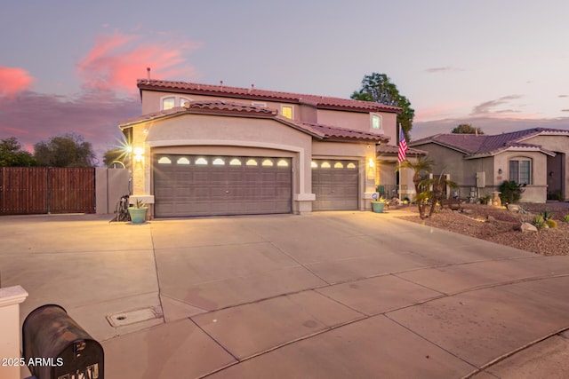 mediterranean / spanish house featuring a garage