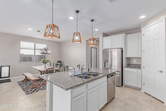 996 W Shannons Way, Coolidge, AZ 85128 - kitchen featuring stainless steel appliances, a sink, recessed lighting, light stone countertops, and white cabinets