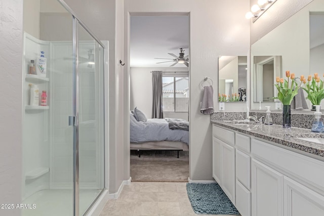 996 W Shannons Way, Coolidge, AZ 85128 - ensuite bathroom with ceiling fan, double vanity, and a stall shower