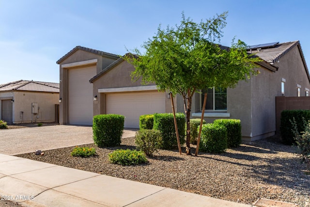 996 W Shannons Way, Coolidge, AZ 85128 - view of front of home featuring a garage, stucco siding, driveway, and a tile roof