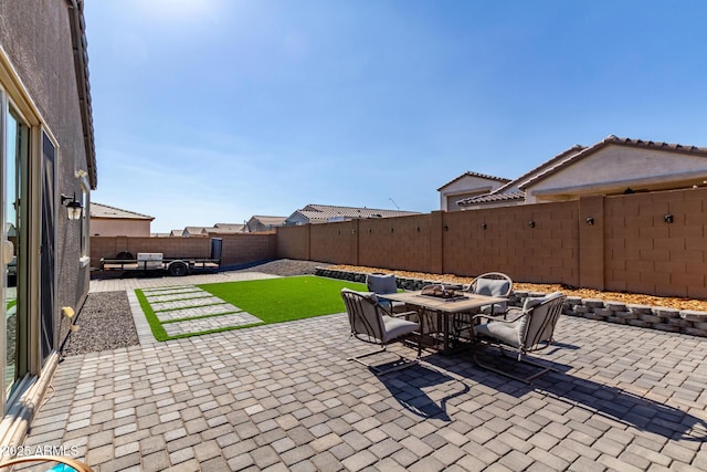 996 W Shannons Way, Coolidge, AZ 85128 - fenced backyard featuring a patio area and outdoor dining area