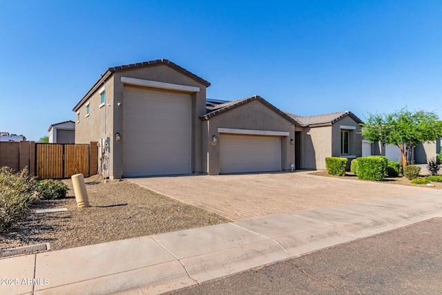 996 W Shannons Way, Coolidge, AZ 85128 - ranch-style house featuring a garage, stucco siding, decorative driveway, and a tiled roof