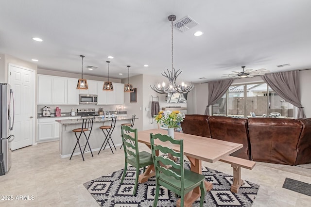 996 W Shannons Way, Coolidge, AZ 85128 - dining room with ceiling fan, recessed lighting, and a chandelier