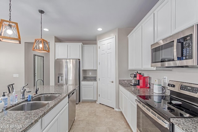 996 W Shannons Way, Coolidge, AZ 85128 - kitchen featuring appliances with stainless steel finishes, a sink, white cabinets, pendant lighting, and recessed lighting